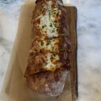 Pane Al Formaggio · Stuffed rustic demi loaf with roasted garlic butter, mixed herbs, mozzarella. Vegetarian