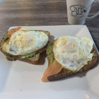 Avocado Toast · Fresh guac on multigrain toast with eggs over easy.