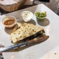 Chicken Quesadilla · Lightly seasoned grilled chicken served with guacamole, fresh salsa and sour cream.