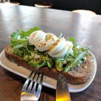 Avocado Toast Breakfast · Seeded multi grain toast with avocado, arugula, feta cheese and hard boiled egg. Available o...