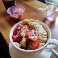Acai Bowl Breakfast · Organic acai, honey almond granola, strawberry, banana and coconut flakes.