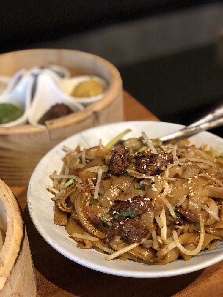 Wagyu Beef Chow Fun · wok seared premium wagyu, flat rice noodle, bean sprouts, egg, onions