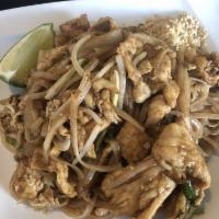 Pad Thai · Stir-fried with ground peanuts, tofu, bean sprouts, onion and scallion with lime on the side.