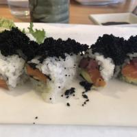 Black Dragon Roll · Tuna, salmon, avocado inside and black caviar outside.