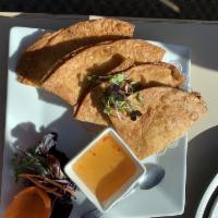 Crab Rangoon · Homemade wontons filled with cream cheese, carrot and chopped onion, served with sweet sauce...