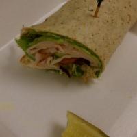 Turkey Wrap · Turkey, provolone cheese, lettuce, tomatoes with cream cheese spread and wrapped in garlic h...