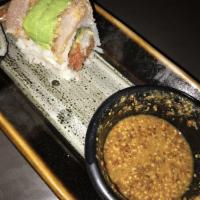 Haji Roll · Spicy tuna, shrimp tempura, cucumber layered with sesame crusted seared albacore and avocado...