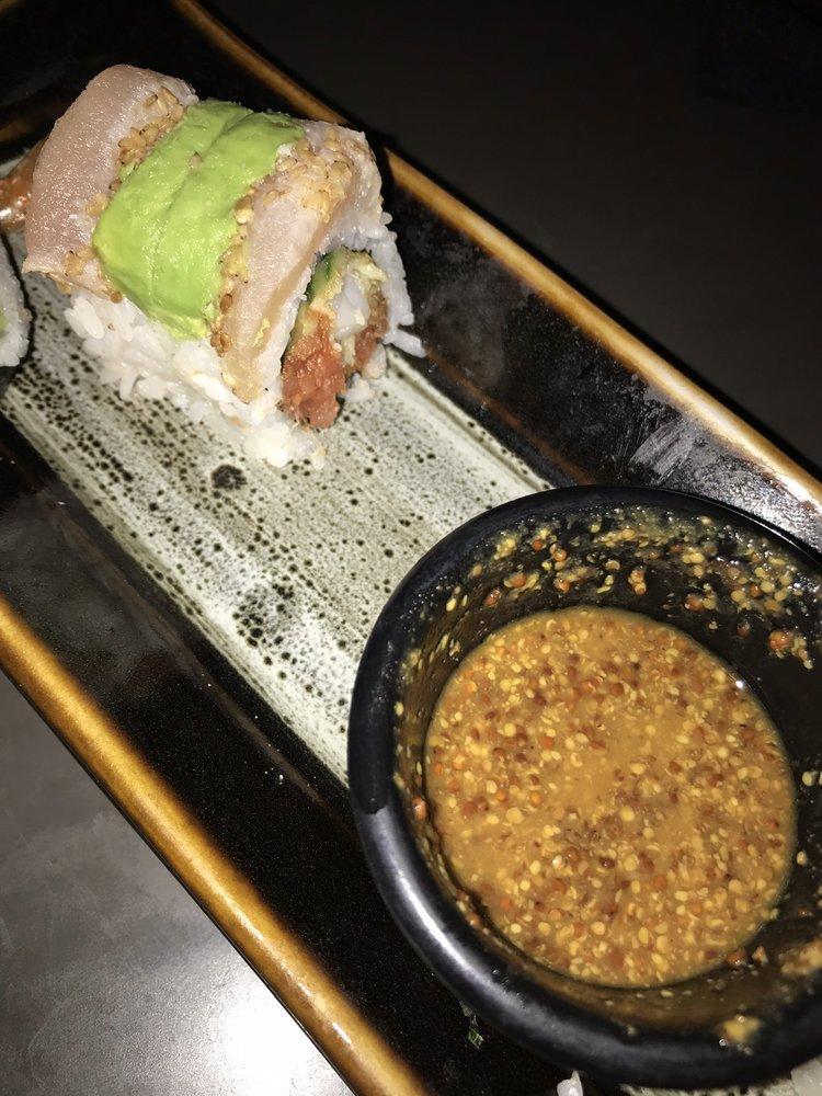 Haji Roll · Spicy tuna, shrimp tempura, cucumber layered with sesame crusted seared albacore and avocado, whole grain mustard sauce on the side.