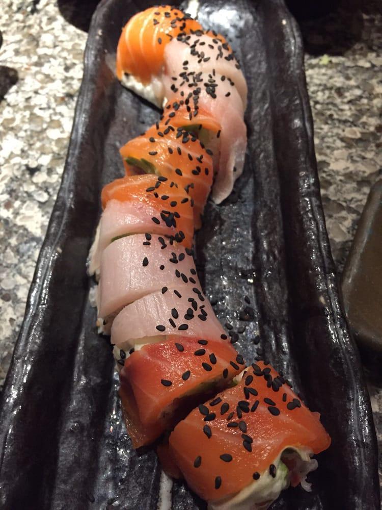 Protein Roll · Spicy tuna, krab, avocado rolled in soy paper, layered with yellowtail and salmon. No rice. 