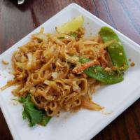 Pad Thai · Traditional Pad Thai noodles tossed with fresh scrambled eggs and bean sprouts, carrots and ...