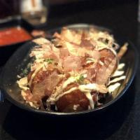Takoyaki Octopus Dumplings · Octopus dumplings with aonori, okonomi sauce, mayo and bonito flakes.