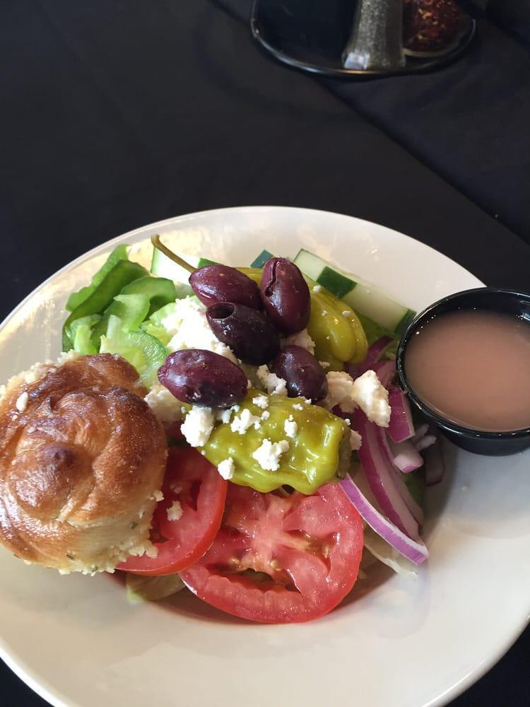 Greek Salad · Tomatoes, Kalamata olives, feta cheese, pepperoncini, red onions, green bell peppers, cucumber and our Greek vinaigrette.