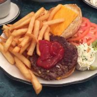 Cheeseburger Deluxe · Served with french fries, lettuce, tomato, pickle and coleslaw.