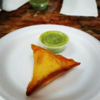 Beef Samosa · Ground beef with peas inside cone made of dough. 1 per order