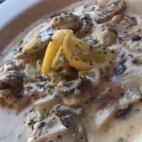 Chicken Piccata · Chicken sauteed in a lemon caper cream sauce with onions and mushrooms served with a choice ...