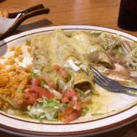 Enchiladas · 3 enchiladas with onions, and your choice of cheese, chicken or shredded beef, served with l...