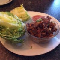 Thai Lettuce Wraps · Chicken, water chestnut, peas, carrots, onions, and garlic. Served with lettuce.
