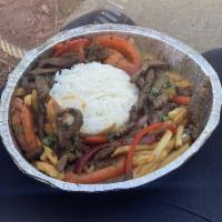 Lomo Saltado · Marinated beef tenderloin strips sautéed with onion, tomato, green and red peppers, and cila...