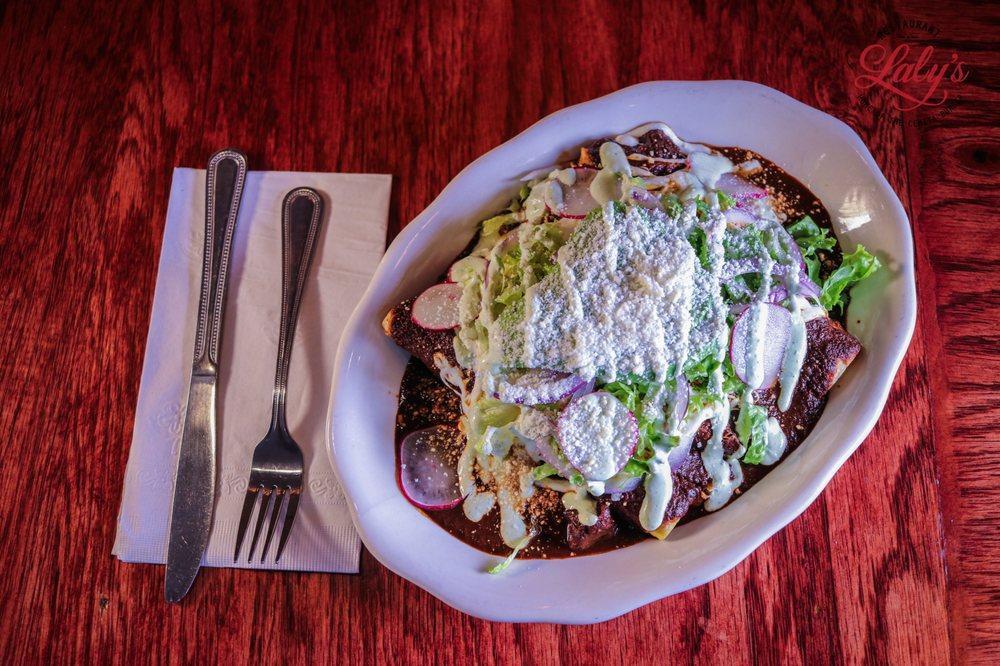 Homemade Mole Enchiladas · corn tortillas stuffed w/ cheese Topped w/ mole poblano sauce, lettuce, radishes, red onion, avocado, cotija cheese & sour cream