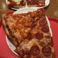 Buffalo Chicken Specialty Pizza · Our famous round pie topped off with a delicious tender white meat Buffalo chicken. Covered ...