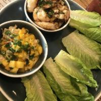 Mexican Lettuce Wraps · Citrus glazed chicken or shrimp and jicama with Mexican mango slaw.