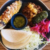 Street Taco Platter · 3 corn tortillas with onion-cilantro mix, shredded cabbage, pickled onion, fresh lime wedges...