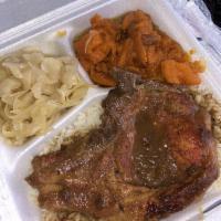 Smothered Pork Chops · Includes: Rice w/ Gravy, 2 sides & cornbread