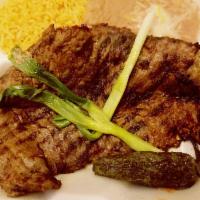 Carne Asada · Delicious broiled steak topped with grill jalapeno and green onion. Served with rice, beans,...