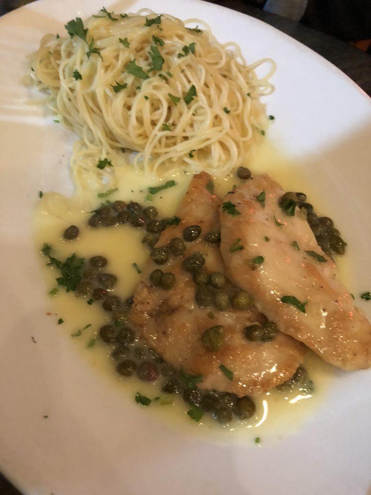 Chicken Piccata · Sauteed medallion of chicken topped with lemon butter sauce.  Served with angel hair pasta topped with butter garlic sauce
