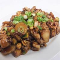 Kung Pao Chicken · Chicken diced and sauteed in rich brown sauce with spring onions and peanuts. Hot and spicy.