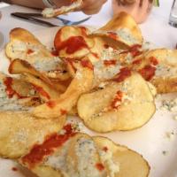 Hell's Fire Chips · Our homemade potato chips, crumbled bleu cheese, and AZ gunslinger hot sauce.