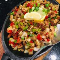Pork Sisig · Finely chopped pork belly and grilled pork ears mixed with onions and bell peppers.