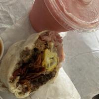 Islander Breakfast Burrito · Carne Asada, Ham, Sausage and Bacon, with Egg, Cheese, Onion and Bell Pepper. 