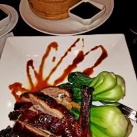 Crispy Duck · Comes with pineapple fried rice with plum sauce.