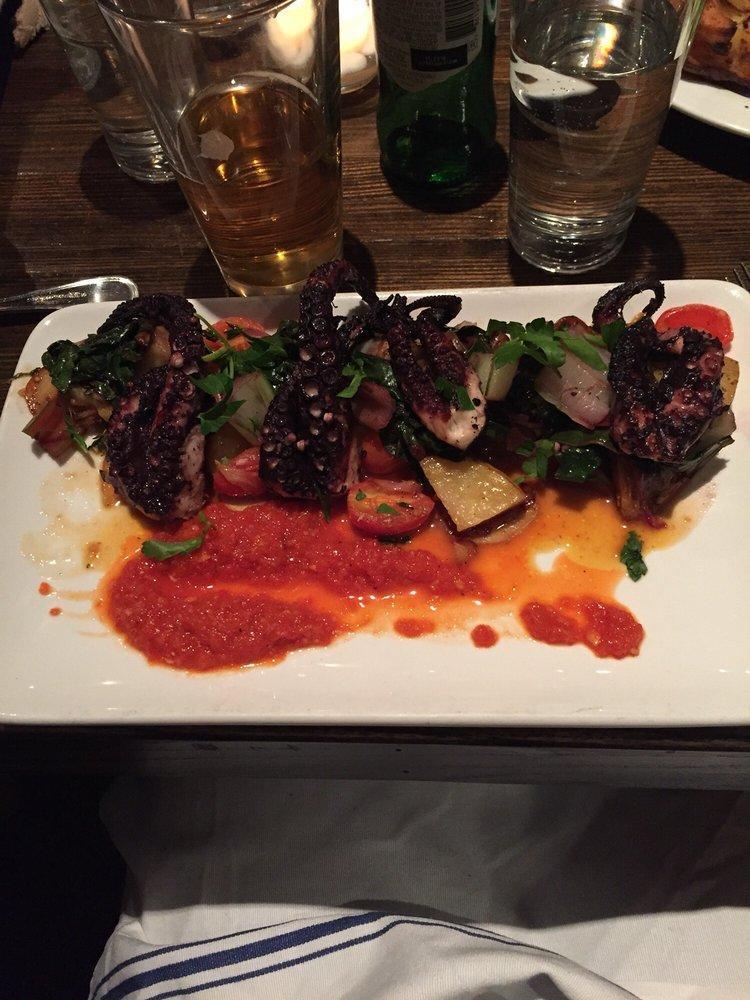 Grilled Octopus · Roasted fingerling potato, chorizo, spinach and romesco sauce.