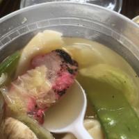 Wonton Soup · Served with choice of roast pork and chicken.