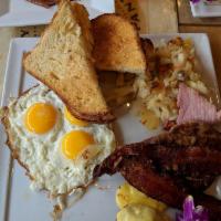 Big Country Breakfast · Three eggs your way, Sweet spiced bacon, HoneyBaked Ham, sausage, crispy hash browns, your c...