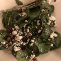 Spinach Salad · Spinach leaves, dried cranberries, goat cheese, and caramelized pecans tossed in homemade ba...