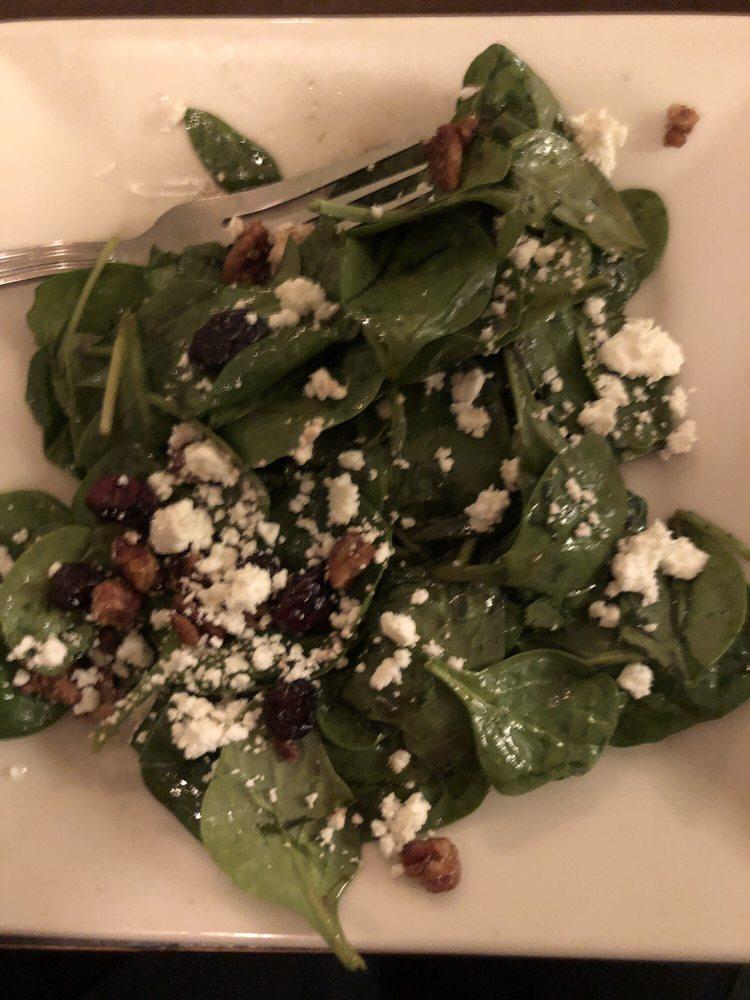 Spinach Salad · Spinach leaves, dried cranberries, goat cheese, and caramelized pecans tossed in homemade balsamic vinaigrette.