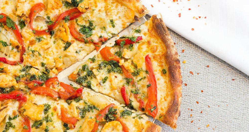 Spicy Pepper Chicken Pizza · Sliced chicken breast, roasted red peppers, caramelized onions, cilantro, oregano, hot red pepper flakes. No tomato sauce.