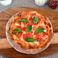 Margherita Pizza · Mozzarella, tomato sauce, tomatoes, fresh basil, olive oil. Vegetarian.