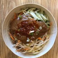 Dan Dan Noodle · Thick wheat noodles topped with a creamy peanut sauce, veggies, and a drizzle of hot oil. Sp...