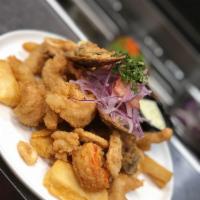 Jalea · Mixed deep fried fresh catch, calamari, shrimp and mussels. On a bed of fried yuca topped wi...