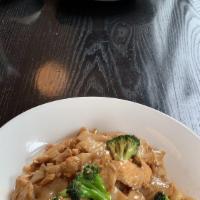 Pad See Ew · Flat rice noodles sautéed with choice of meat, egg and broccoli in Thai sweet soy sauce.