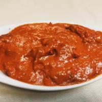 Butter Chicken · Roasted shredded chicken cooked in creamy tomato sauce with Indian spices.