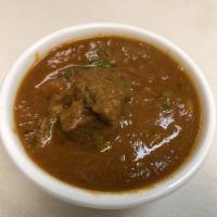Lamb Curry · Favorite. Simmered in onion and tomato sauce with a blend of aromatic herbs and spices.