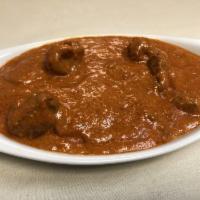 Lamb Tikka Masala · Marinated with our special red sauce with yogurt and herbs, and cooked in tandoor.