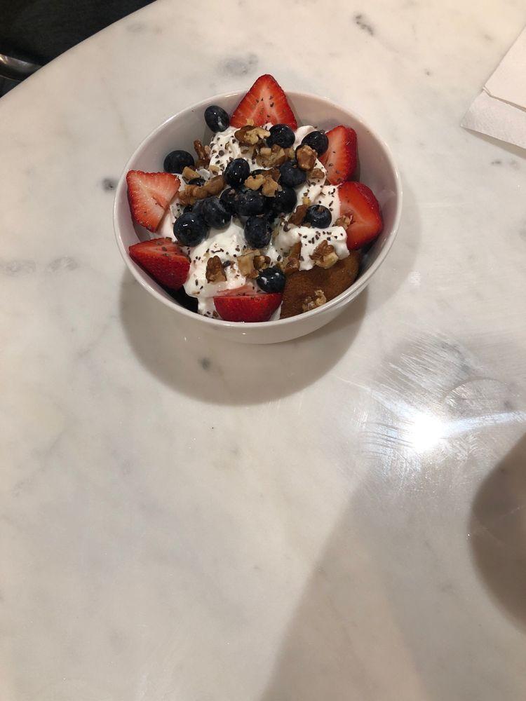 Yogi Yogurt Bowl · Protein Paleo muffin, Greek yogurt, bananas and berries, walnuts, raw cacao nibs and cinnamon. Gluten free.