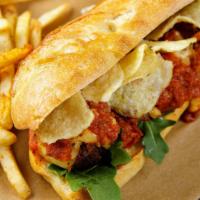 Meatball Sub · Plant-based meatballs on a toasted baguette, spicy tomato sauce, melted smoked provolone, ro...