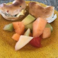 Breakfast on a Bagel Sandwich · Your choice of bagel with scrambled eggs, bacon and herbed cream cheese. Served with fresh f...